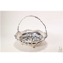 Sterling silver footed basket with rose motif handle and edging, 9 1/2" in diameter