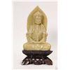 Image 1 : Green soapstone carved Buddha on a dark stone base, 7 3/4" in height