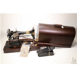 Vintage portable Singer no. 99 electric sewing machine with dome top case and original key plus seve