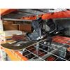 Image 1 : Black snowboard with bindings and boots