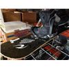 Image 2 : Black snowboard with bindings and boots