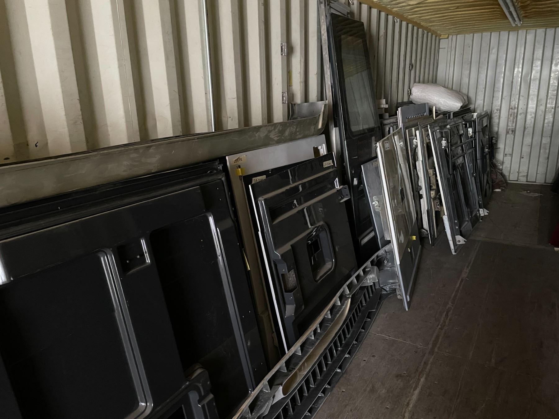 CONTENTS OF SHIPPING CONTAINER INCLUDING BUS DOORS, WINDOWS, BUMPERS ...