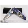 Image 1 : FOLDING KNIFE WITH BELT CLIP AND WOLF DESIGN