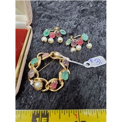 Gold tone broach and screwback earrings set with semi-precious stones