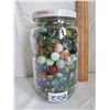Image 1 : Pickle jar filled with marbles.