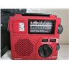 Image 2 : Emergency shortwave AM FM crank and battery radio. It has a light and comes in a canvas carry case.