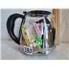 Image 1 : Coffee pot filled with magnets and other delights.