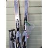 Image 4 : Vintage downhill skis 7 poles, with boot buckler and straps. Vehicle roof rack.