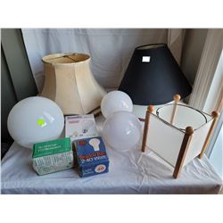 Assorted vintage lamp shades, globes and light bulbs.