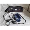 Image 1 : Blood pressure cuff and monitor with a storage bag.