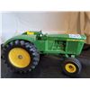 Image 1 : John Deere tractor with steerable rubber wheels.