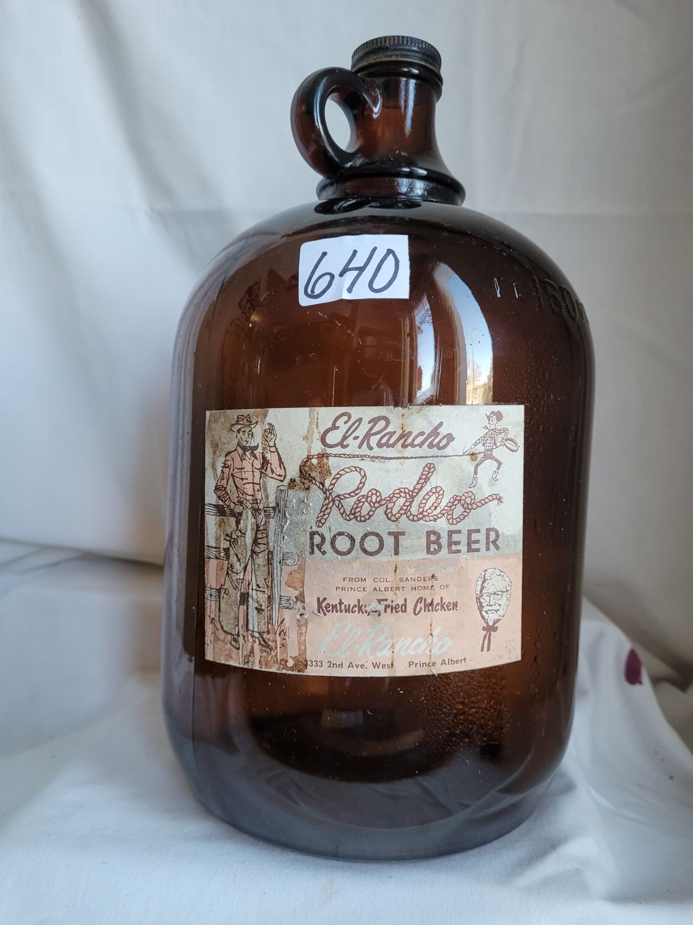 El Rancho Rodeo Root beer Jug. - Schmalz Auctions