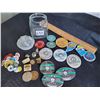 Image 1 : Jar of metal pins, golf ball markers and pin on festival buttons.