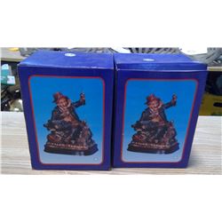 2 figurines in boxes