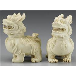 PAIR OF CHINESE CARVED COMPOSITE LIONS