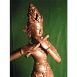 Hindu figure playing flute #1483414