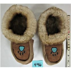 Women's size 9 sheepskin lined moccasins bear paw logos