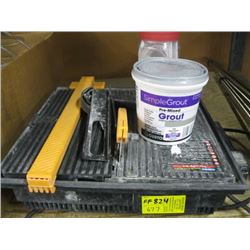 ELECTRIC TILE SAW & A CONTAINER OF GROUT