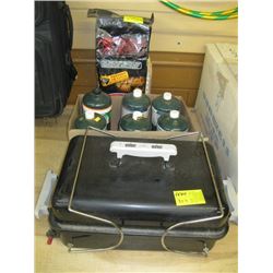 TABLE TOP PROPANE BBQ WITH CANNISTERS & A BAG OF BRIQUETTES. SOME CANNISTERS NEW, SOME EMPTY
