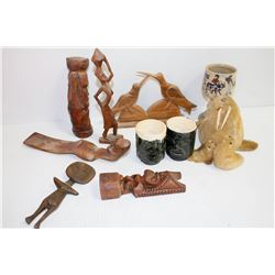 BIN OF VINTAGE WOOD CARVED STATUES SEAL SKIN