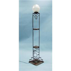ART DECO - A hand hammered wrought iron floor lamp with a fr