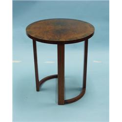 ART DECO - A circular walnut and mahogany table with a burle