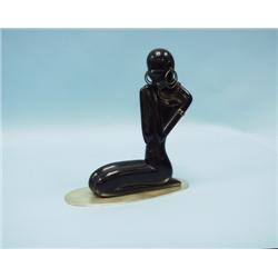 HAGENAUER, AUSTRIA. A carved, ebonized wood sculpture of an 