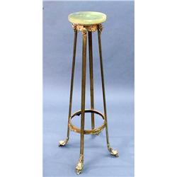 An antique French Empire style gilt bronze and onyx pedestal