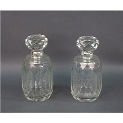 A good pair of crystal decanters with sterling silver mounti
