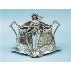 ART NOUVEAU - W. HERRING. A silver patinated bronze jardinie