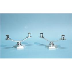 ART DECO - A pair of silver patinated bronze candle holders.