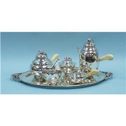 A Georg Jensen style "Blossom" pattern six piece sterling si