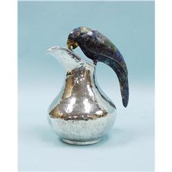 An unusual hand hammered Mexican sterling silver jug. Handle