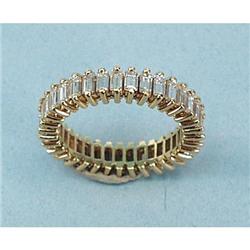 An unusual 18 kt. yellow gold eternity ring set with a serie