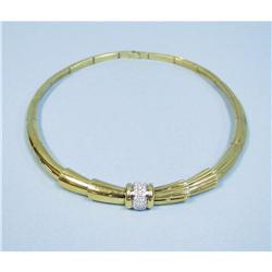 A 1970's well made yellow gold and diamond necklace. Segment