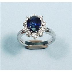 A classical design sapphire and diamond ring. Full cut diamo