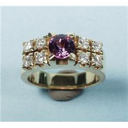 An l8 kt. yellow gold ring mounted with a central circular c