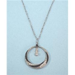 ART DECO - A platinum and diamond pendant. Onyx and diamond 