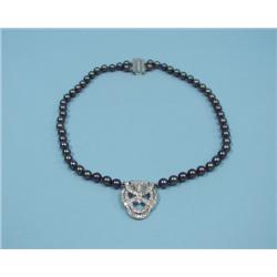 ART DECO - A platinum and diamond shield shaped pendant set 