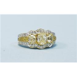 An 18 kt. white gold and diamond band ring set with three ov