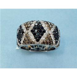 An unusual 18 kt. white gold and diamond band ring set with 