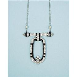 ART DECO - A platinum, black onyx and diamond pendant. Centr