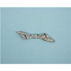 ART DECO - A platinum and diamond bow brooch set with a fine