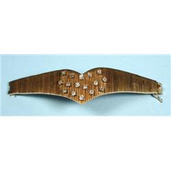 A heavy 18 kt. yellow gold and diamond bracelet. Segmented s