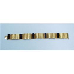 ART DECO - An attractive 14 kt. gold and onyx bracelet of ge