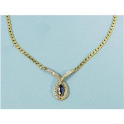 A 1960's 14 kt. yellow gold and diamond pendant set with a m