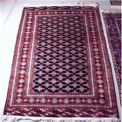 A Baluchi wool rug. Approx. size: 6'3" x 4'3".