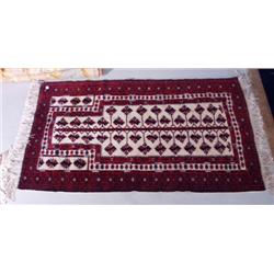 A Baluchi wool carpet. Approx. size: 5'5" x 3'1".