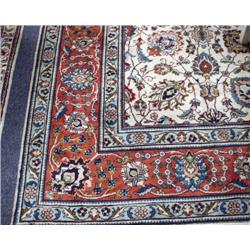 A semi-antique Persian Tabriz carpet. Approx. size: 8'6" x 1