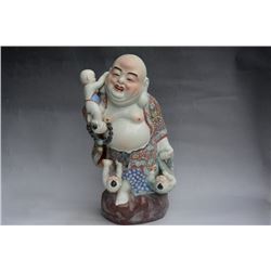A PORCELAIN ENAMEL BUDDHA FIGURE QING DYNASTY 17TH/C.